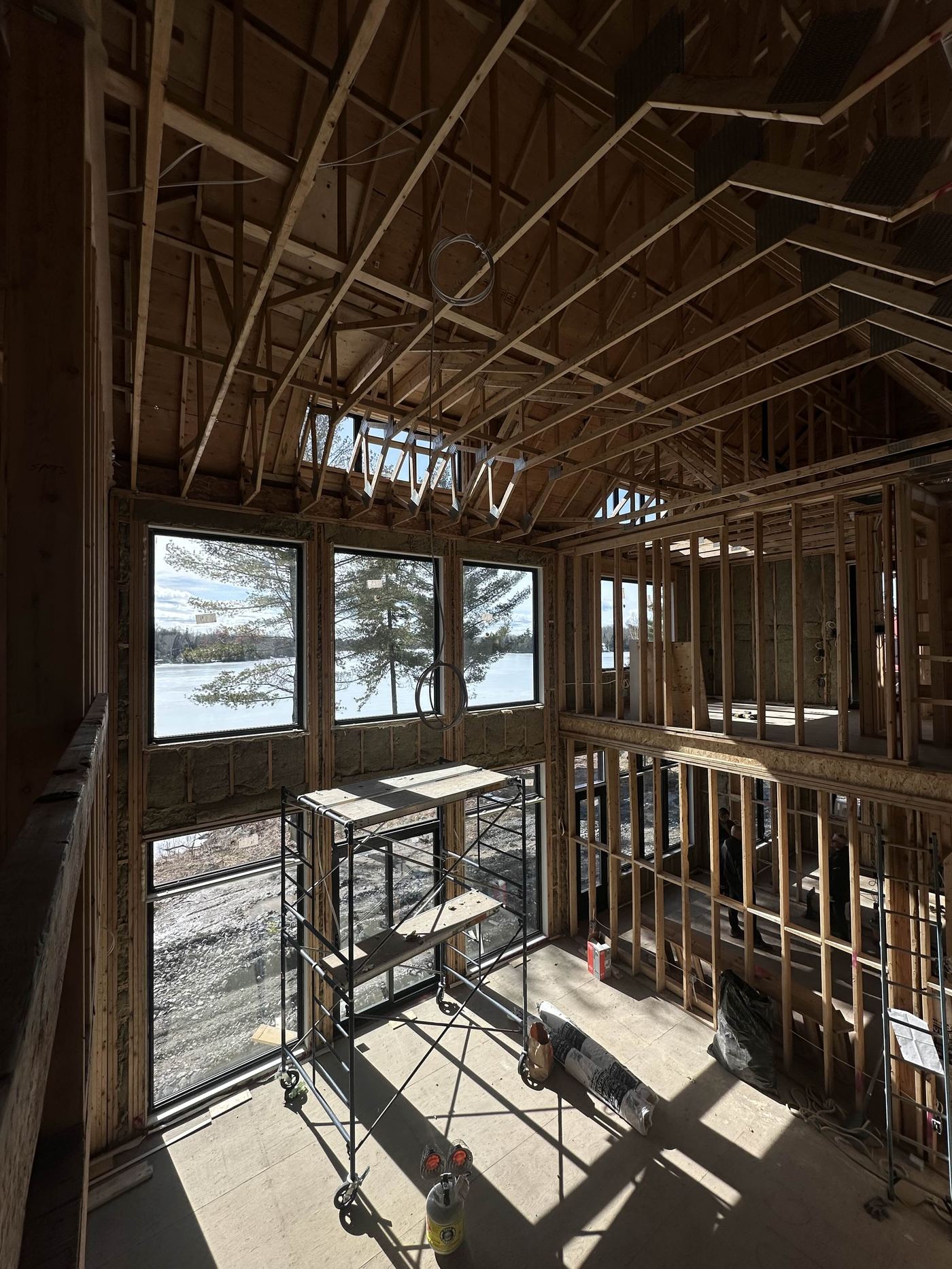 New build framing — open stud construction, lake view, cathedral ceiling